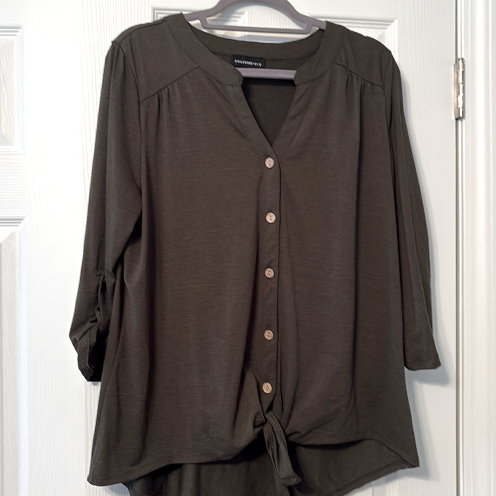 Button down shirt with tie at the bottom
